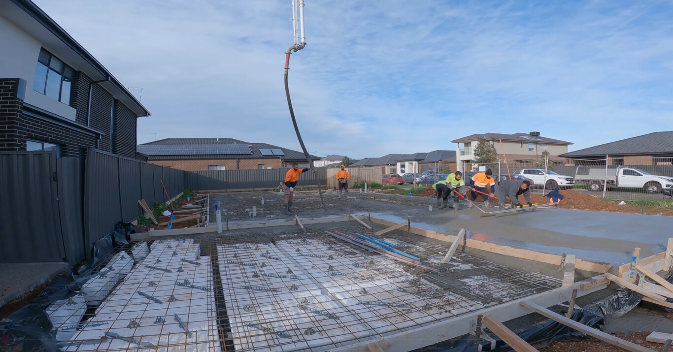 Professional concrete slab foundation being poured for residential construction in St. George, UT