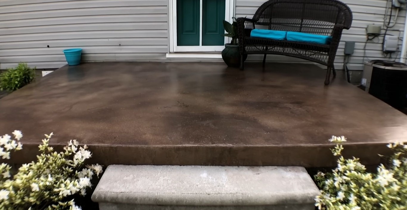 Decorative stained concrete patio with outdoor furniture in St. George, UT